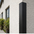 Black 70x70mm PVC corner angle trim protecting an exposed building corner