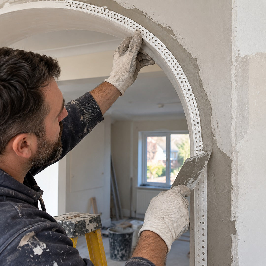 25x25mm flexible PVC arch corner bead being fitted around a curved plaster arch by a plasterer