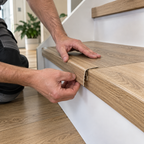 16x25mm push-in wood effect PVC stair nosing installed on a residential staircase during flooring renovation