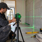360 degree 5-line green laser level projecting alignment lines during a professional tiling renovation