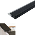 Black stair tread with white label and measurements on a white background