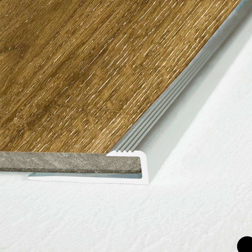 Close-up of a wooden floor with a metal threshold on a white background