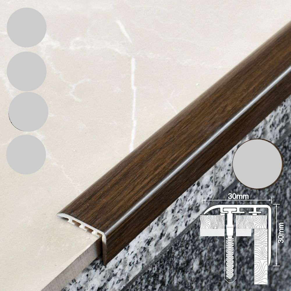 Wooden threshold strip with UPVC label and dimensions on a marble and concrete surface.