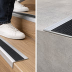 A33 40 x 20mm anodised aluminium non slip ribbed stair nosing installed on wood-effect stairs with a person using the staircase