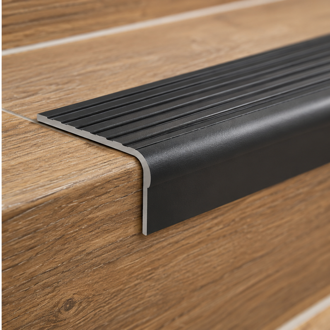 Close-up of A41 35 x 35mm anodised aluminium non slip ribbed stair nosing showing the grooved tread and rounded edge
