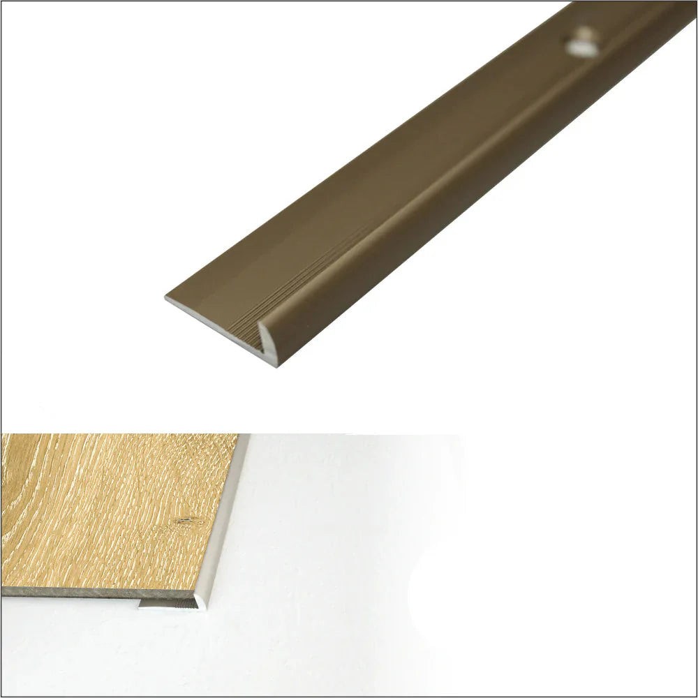 Champagne-colored metal threshold with installation details on a white background