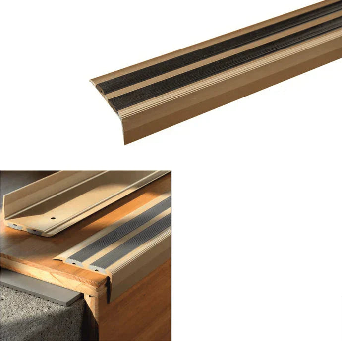 Gold stair tread with black rubber strip, showing installation details and dimensions.