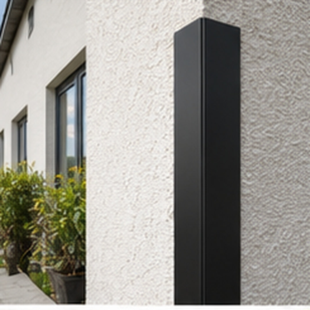 Black 70x70mm PVC corner angle trim protecting an exposed building corner
