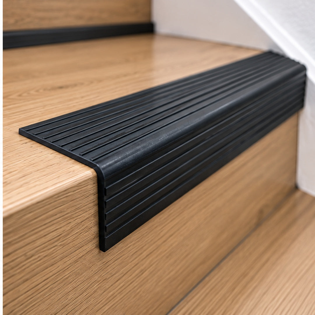 Close-up of 70x40mm RGPD flexible PVC non-slip stair nosing fitted to a stair edge