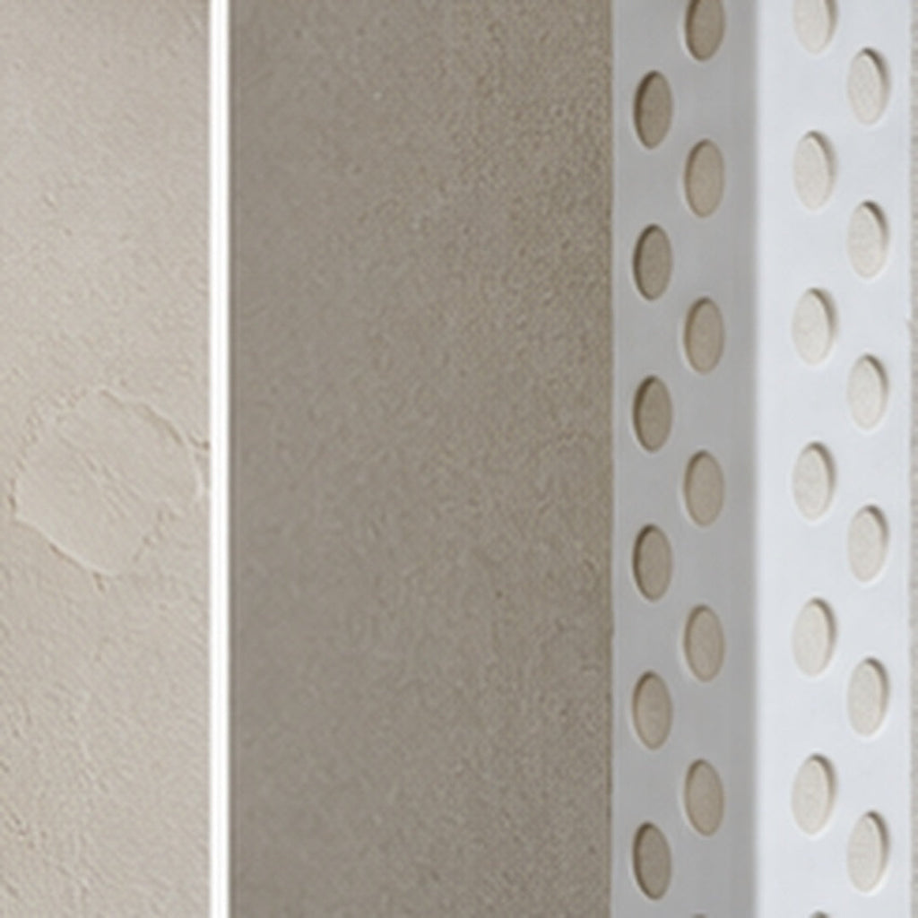 Close-up of 23x23mm PVC universal render corner bead beneath fresh plaster