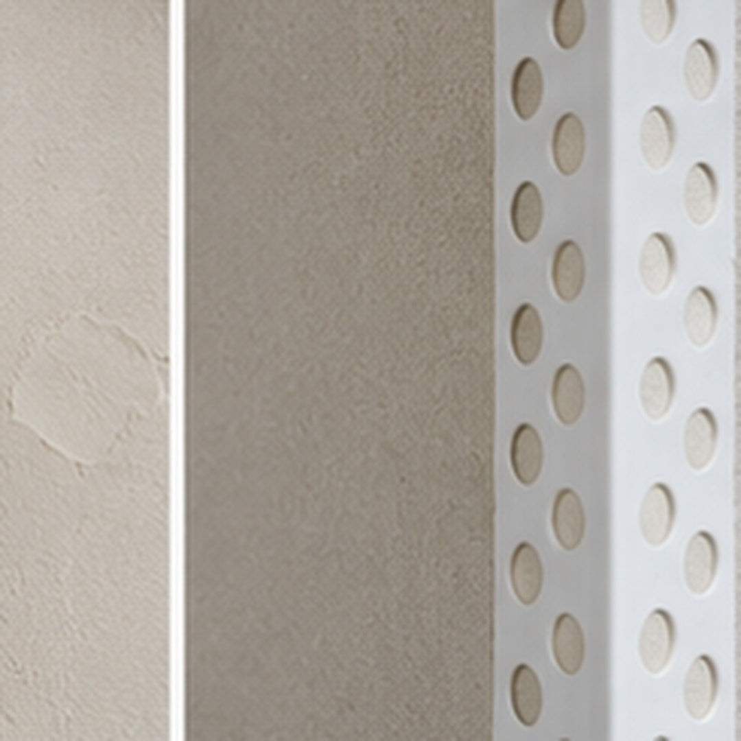 Close-up of 23x23mm PVC universal render corner bead beneath fresh plaster