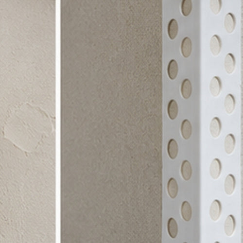Close-up of 23x23mm PVC universal render corner bead beneath fresh plaster
